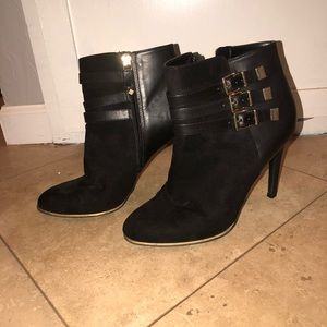 Black boot heels with gold buckle
